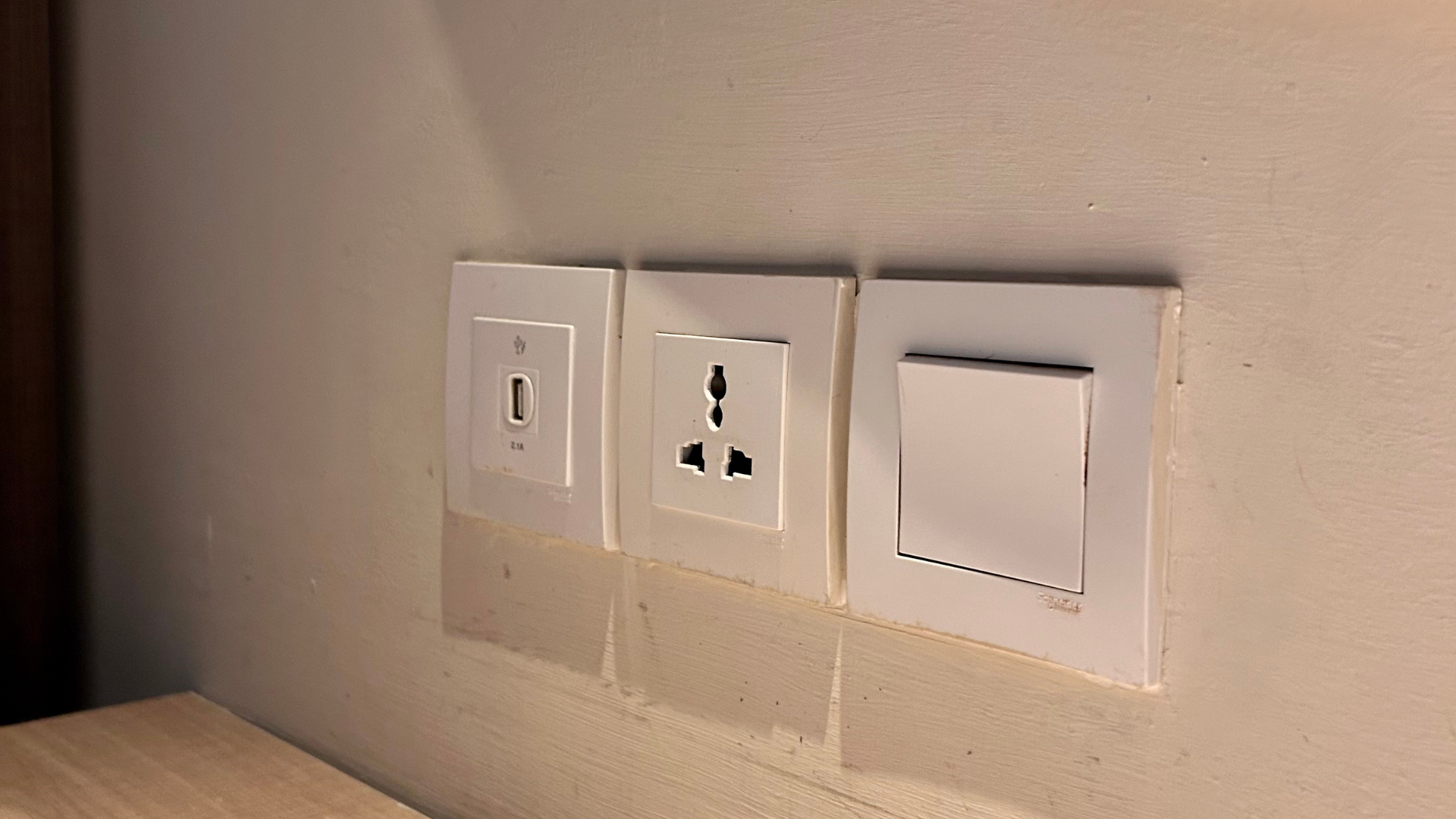 USB socket, twin socket and light switch installed cleanly on a domestic wall