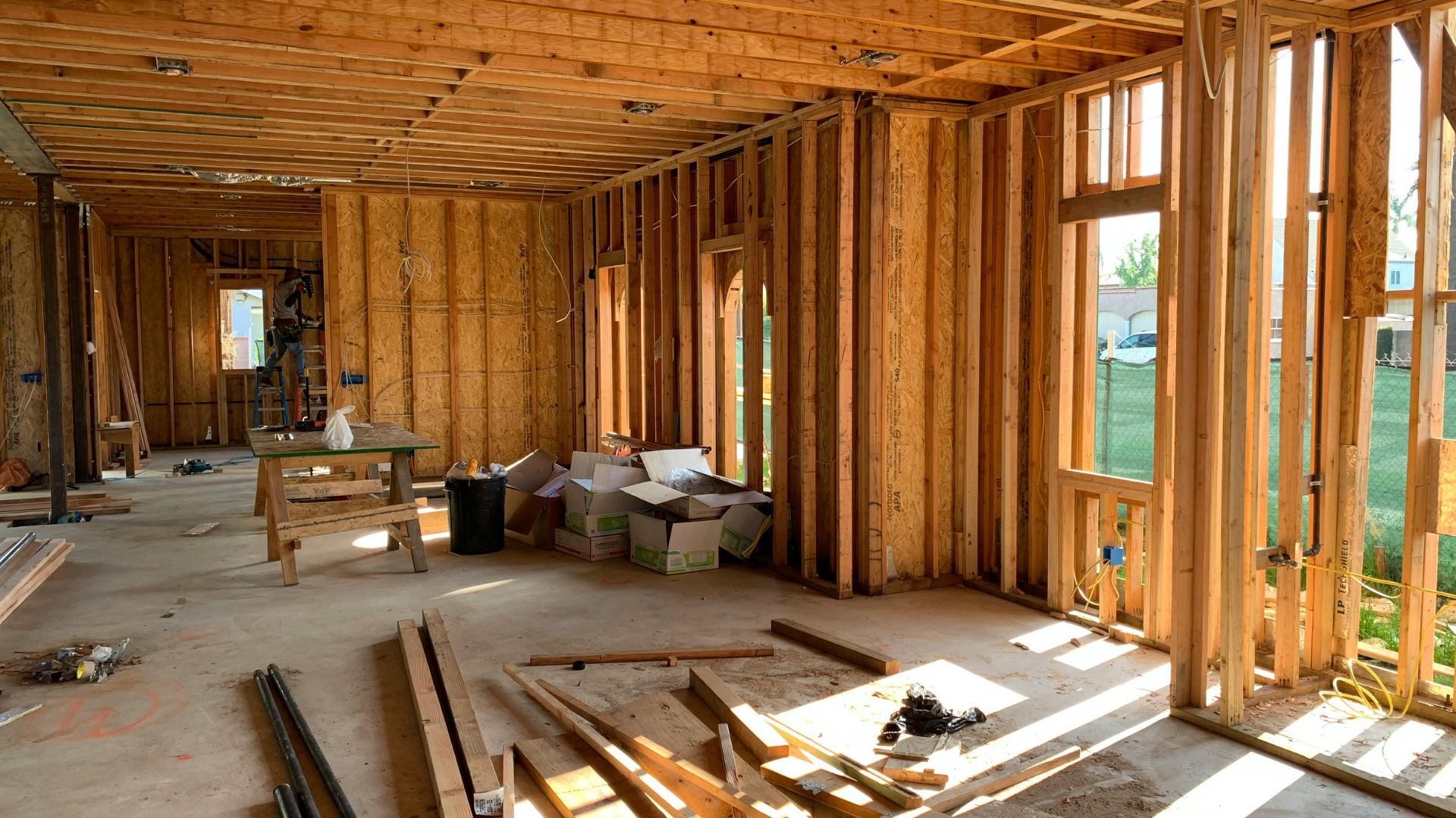 First-fix wiring run through timber-framed stud walls on a house rewire project
