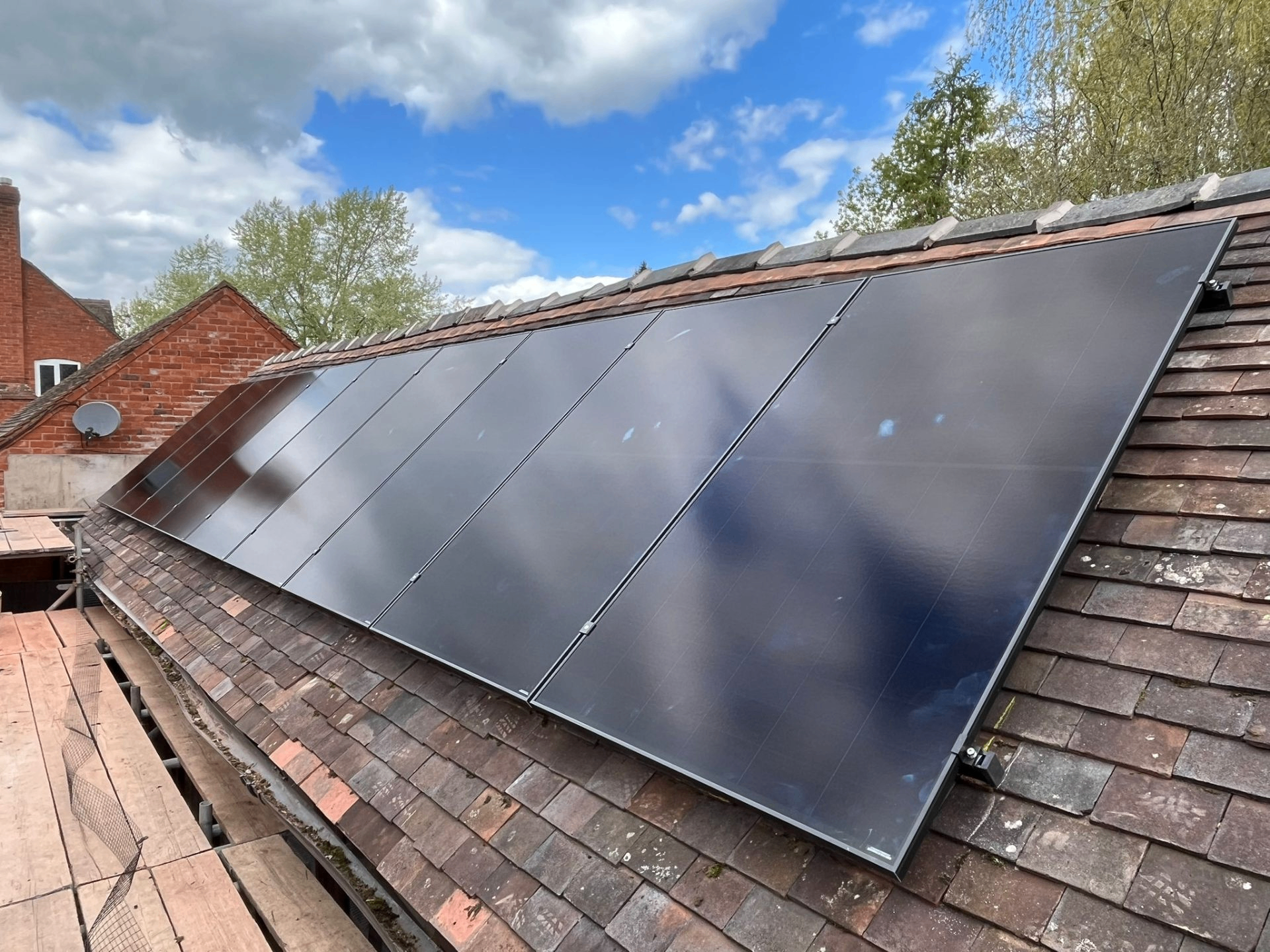 Completed solar panel installation on a UK pitched tile roof
